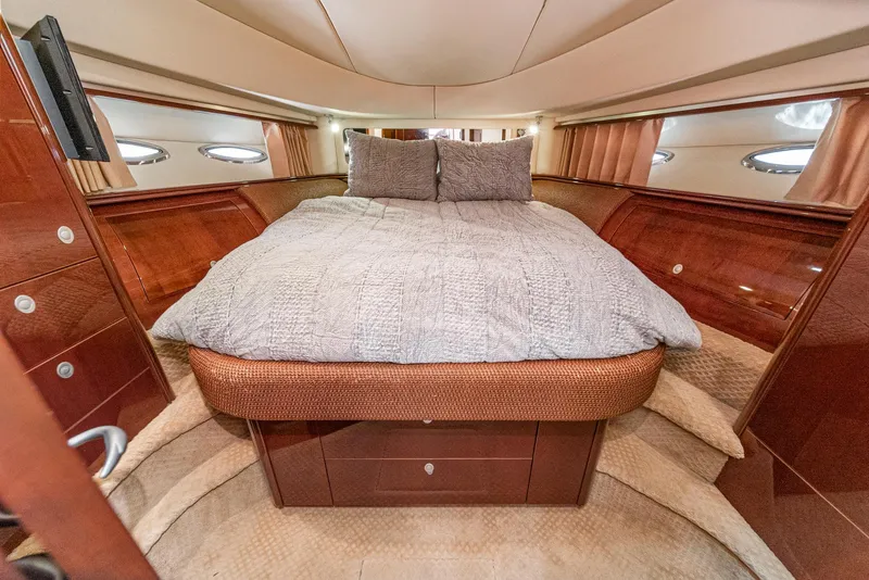 Slide: The Image of Luxurious bedroom interior of 2008 Sea Ray 58 Sedan Bridge yacht with elegant wood finish. - 34