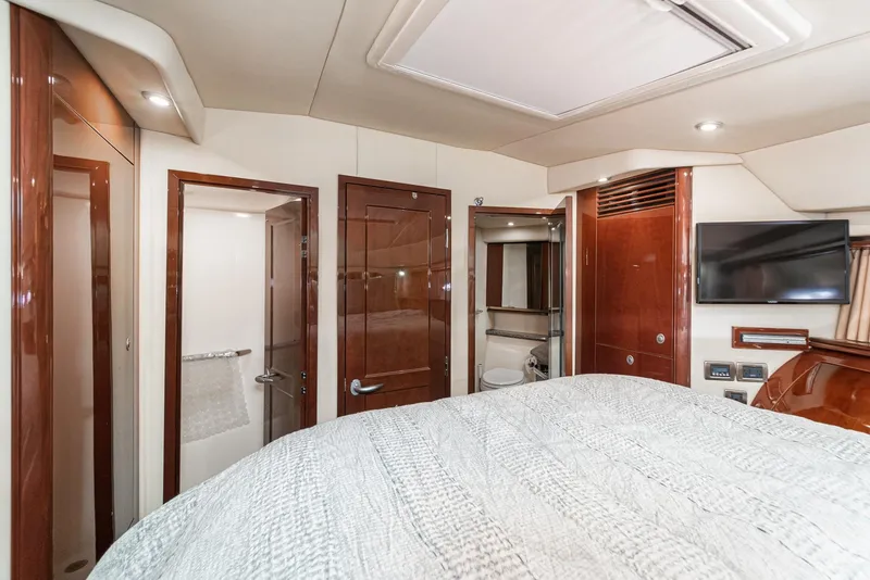 Slide: The Image of Luxurious interior of 2008 Sea Ray 58 Sedan Bridge yacht cabin with wood finishes. - 36