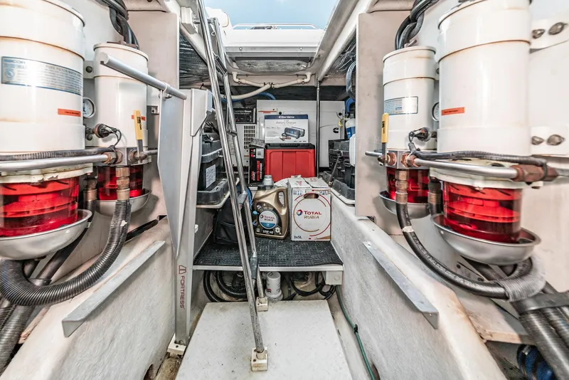 Slide: The Image of Engine room of 2008 Sea Ray 58 Sedan Bridge with filters and equipment. - 43