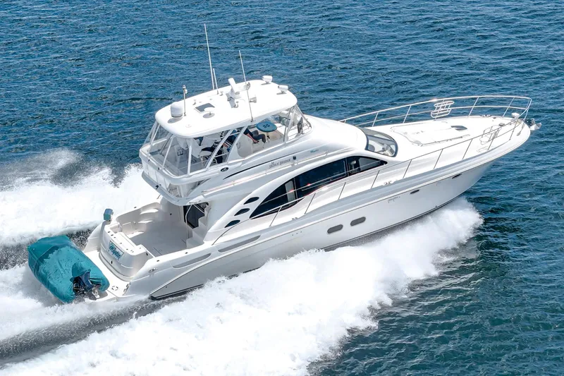 Slide: The Image of 2008 Sea Ray 58 Sedan Bridge yacht cruising on open water. - 8