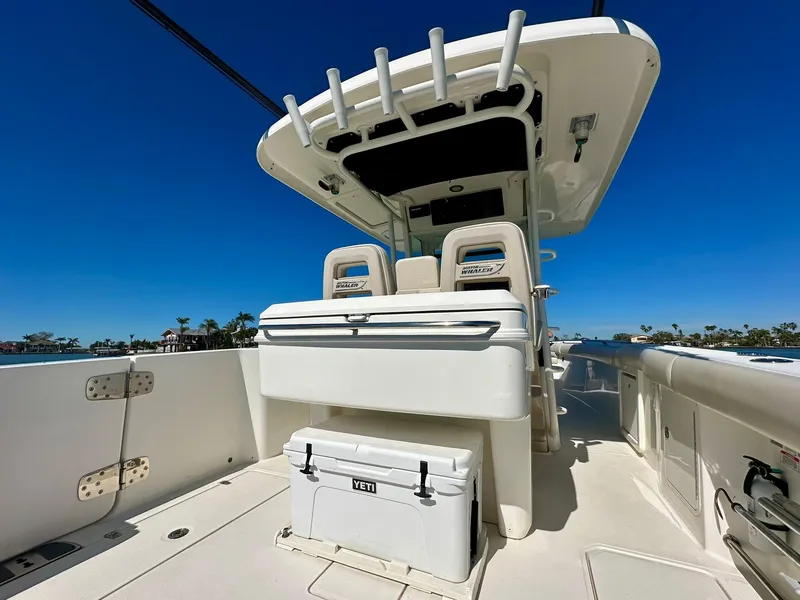 Slide: The Image of 2022 Boston Whaler 330 Outrage boat interior with seating and Yeti cooler. - 29