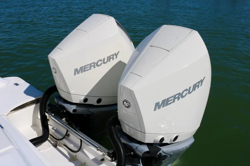 Slide: The Image of Twin Mercury outboard engines on a 2022 Boston Whaler 330 Outrage boat. - 41