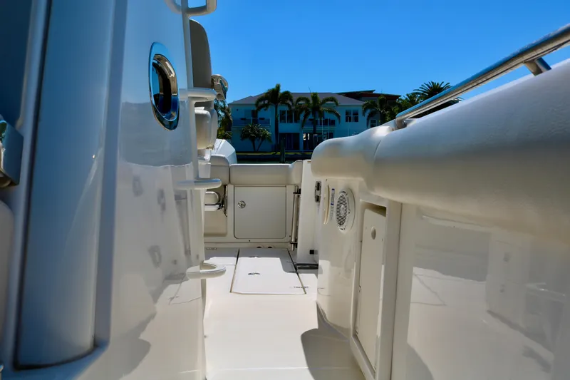 Slide: The Image of 2022 Boston Whaler 330 Outrage boat interior with sleek white design and modern features. - 46