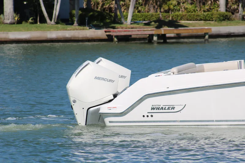 Slide: The Image of Boston Whaler 330 Outrage 2022 with Mercury engine on calm water. - 9