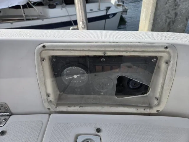 Slide: The Image of Control panel of a 2002 Hunter 356 sailboat, featuring gauges and dials. - 15
