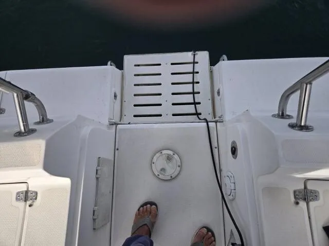 Slide: The Image of Hunter 356 boat deck, 2002 model, featuring white surface and metal railings. - 19