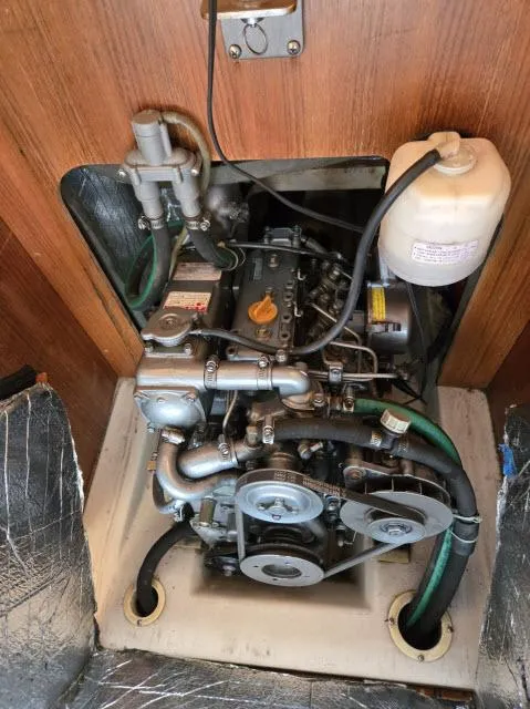 Slide: The Image of 2002 Hunter 356 engine compartment with visible components and wiring. - 22