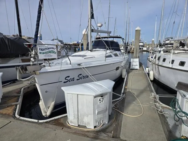 Slide: The Image of Hunter 356 sailboat, 2002 model, named "Sea Siren" docked at marina, slip 57. - 27