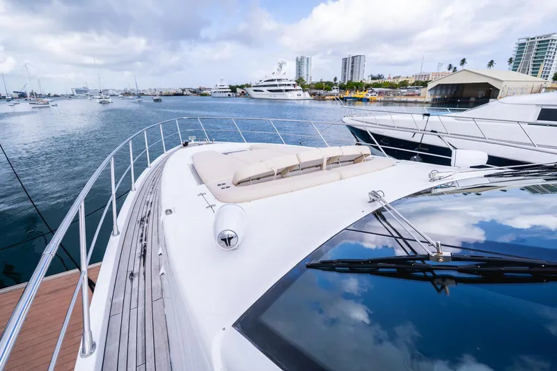 Slide: The Image of Luxury Azimut 86S yacht docked in marina, 2010 model, with sleek design and spacious deck. - 14