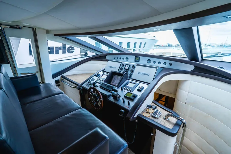 Slide: The Image of Cockpit of 2010 Azimut 86S yacht with modern navigation equipment and leather seating. - 21