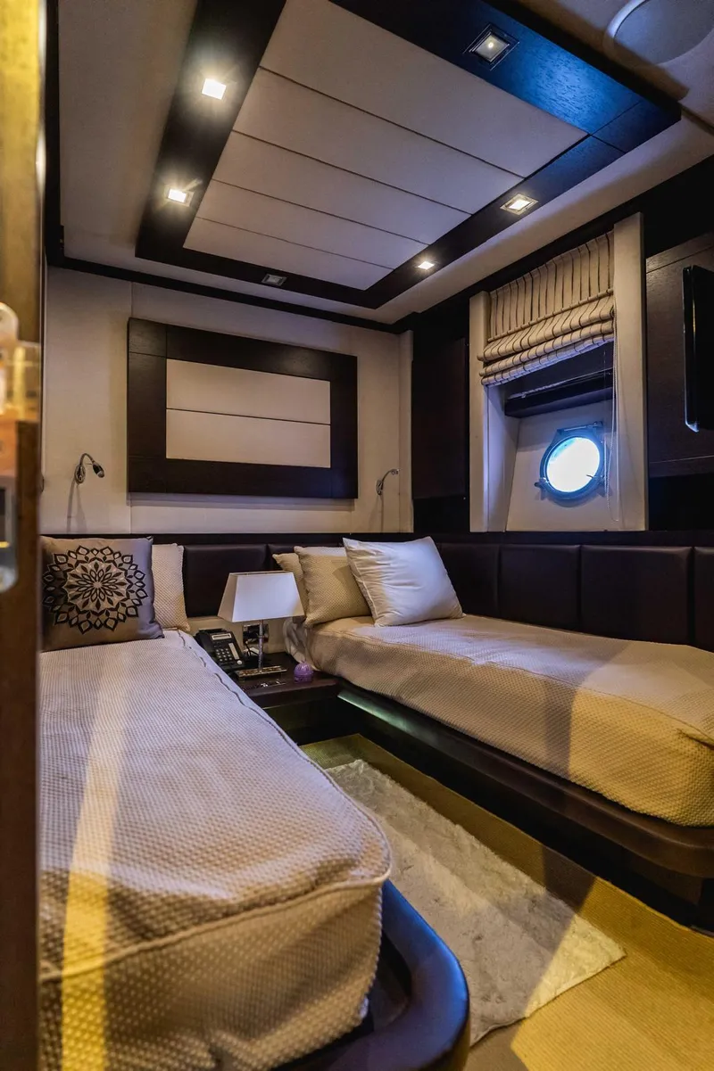Slide: The Image of Luxurious cabin interior of 2010 Azimut 86S yacht with twin beds and elegant decor. - 5