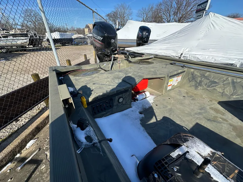 Slide: The Image of 2016 Tracker Grizzly 1760 MVX Sportsman boat with Mercury outboard, parked outdoors in winter. - 6