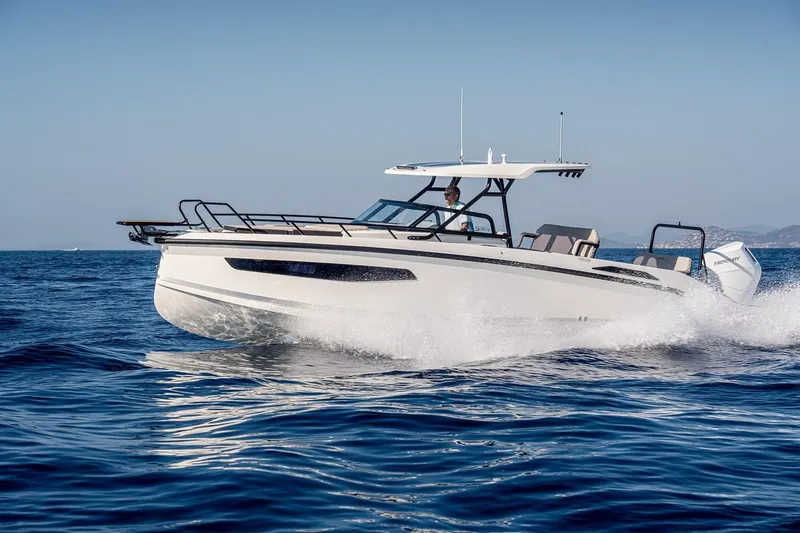 Slide: The Image of 2025 Navan S30 boat cruising on open water, showcasing sleek design and performance. - 0