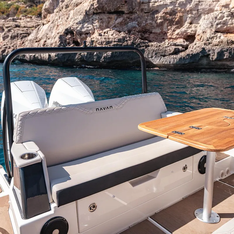 Slide: The Image of 2025 Navan S30 boat dashboard with dual Simrad displays and steering wheel. - 2