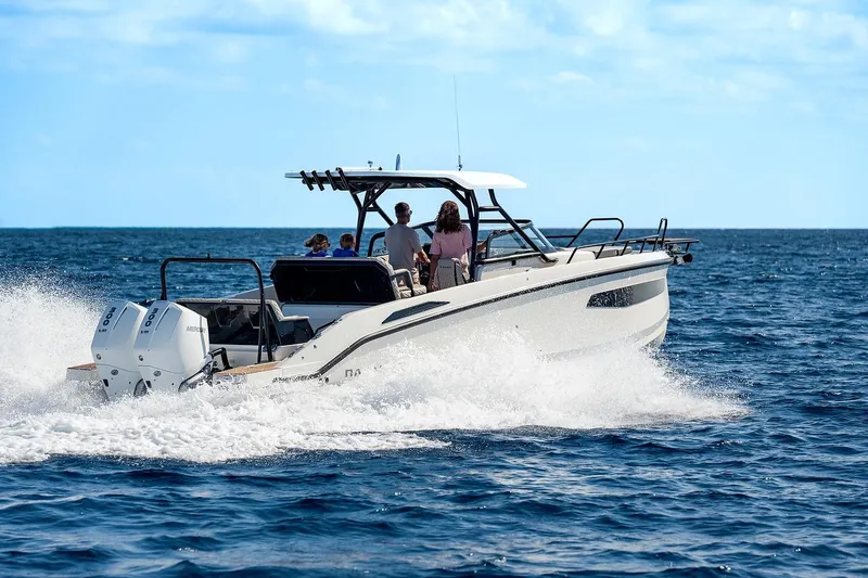 Slide: The Image of 2025 Navan S30 boat with dual 300 V8 engines cruising on water. - 21