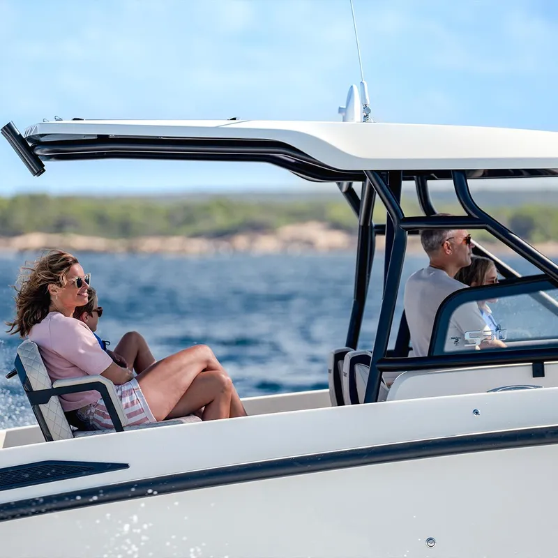 Slide: The Image of Couple enjoying a ride on a 2025 Navan S30 boat, sunny day. - 9