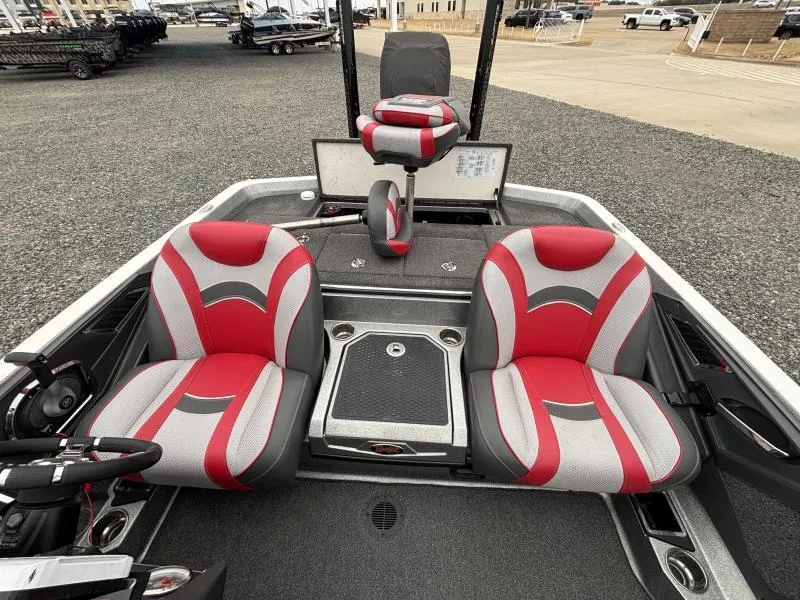 Slide: The Image of 2018 Ranger Z520L boat interior with red and gray seats, steering wheel, and console. - 12