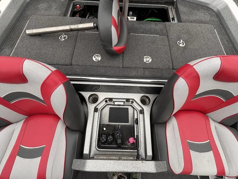 Slide: The Image of 2018 Ranger Z520L boat interior with red and gray seats, storage compartments, and control panel. - 13