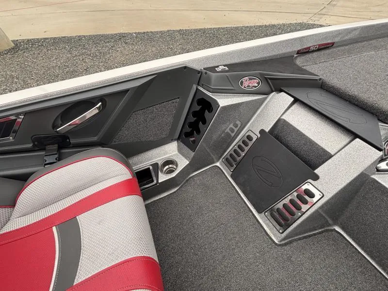 Slide: The Image of 2018 Ranger Z520L boat interior with red and gray seating and storage compartments. - 14