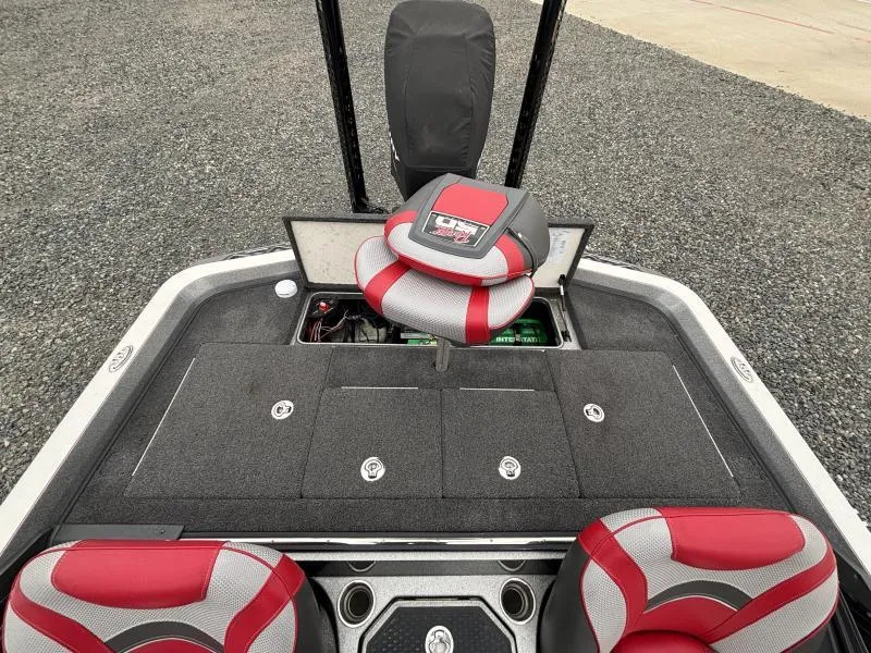 Slide: The Image of 2018 Ranger Z520L boat interior with red and gray seats, storage compartments, and a control panel. - 7