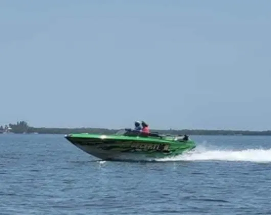 Slide: The Image of 1987 Chaparral Villan II speedboat cruising on open water. - 12
