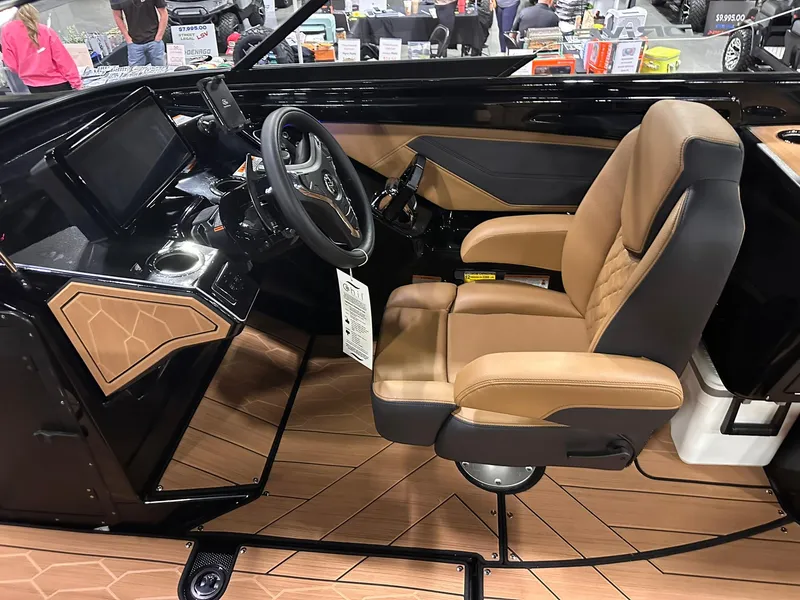 Slide: The Image of 2025 Yamaha Boats 255XD interior with luxurious seating and modern dashboard. - 15