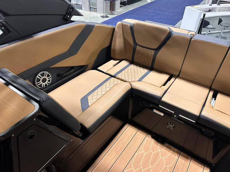 Slide: The Image of Luxurious interior seating of 2025 Yamaha Boats 255XD, featuring tan and black upholstery. - 16