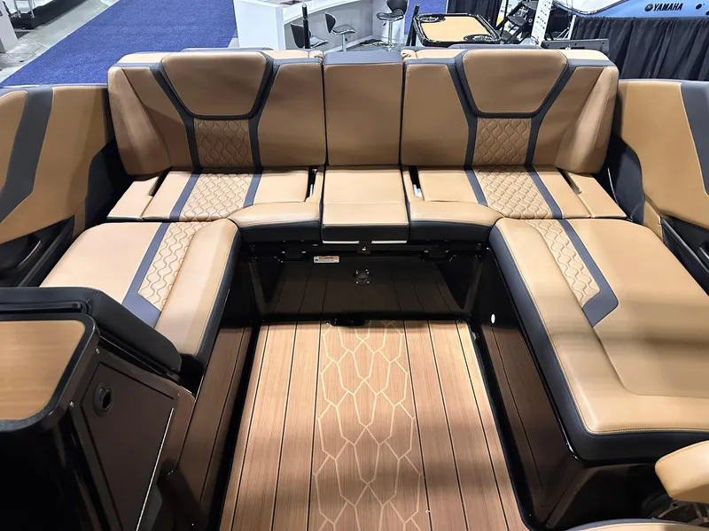 Slide: The Image of 2025 Yamaha Boats 255XD interior with luxurious tan seating and stylish design. - 17