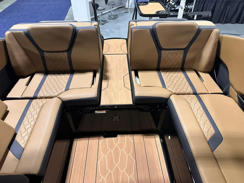 Slide: The Image of 2025 Yamaha Boats 255XD interior with luxurious tan seating and sleek design. - 19