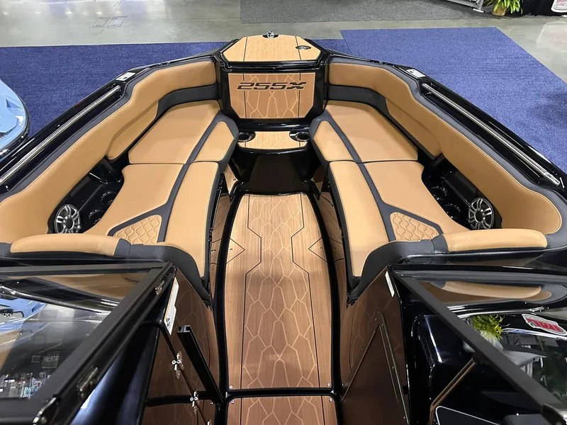 Slide: The Image of 2025 Yamaha Boats 255XD interior with tan seating and sleek design. - 20