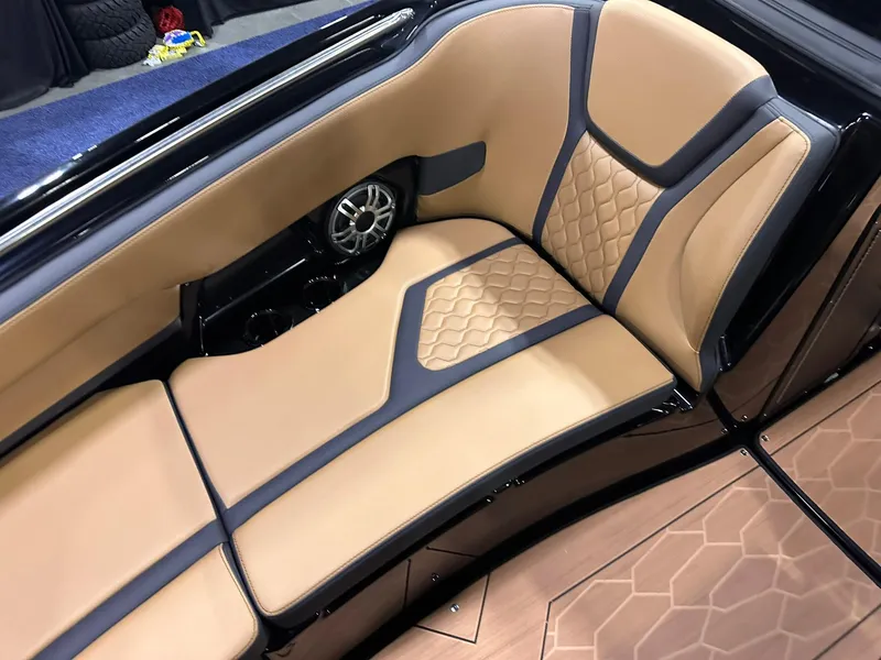 Slide: The Image of Luxurious interior seating of 2025 Yamaha Boats 255XD with tan and black upholstery. - 25