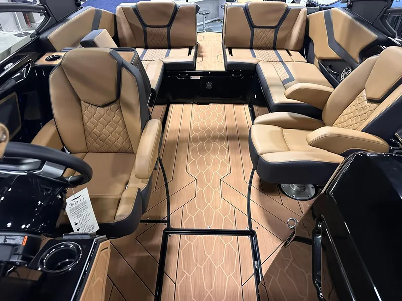 Slide: The Image of 2025 Yamaha Boats 255XD interior with luxurious tan seating and sleek design. - 27