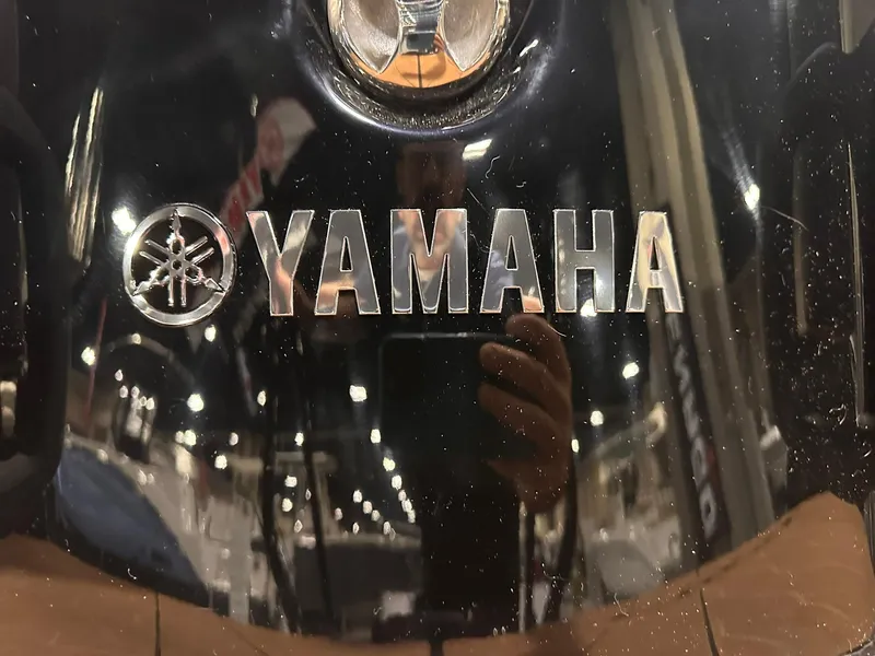 Slide: The Image of Yamaha Boats 255XD 2025 logo on a glossy black surface. - 38