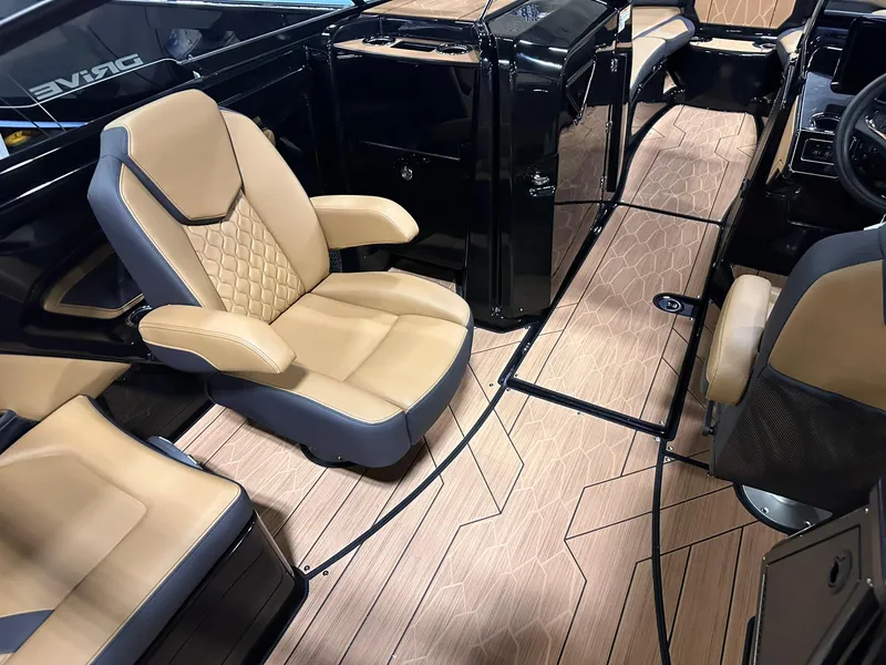 Slide: The Image of 2025 Yamaha Boats 255XD interior with tan seats and sleek design. - 9