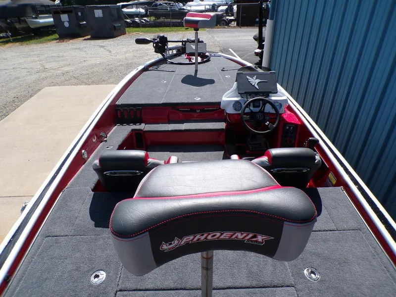 Slide: The Image of Close-up of Phoenix 920 Elite 2025 boat control panel in a garage setting. - 11