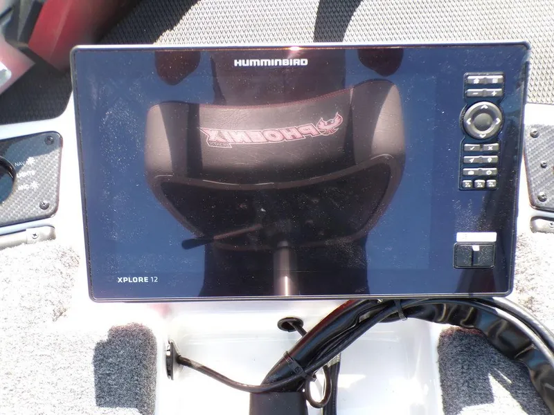 Slide: The Image of Interior of 2025 Phoenix 920 Elite boat with red and gray seating and storage compartments. - 14