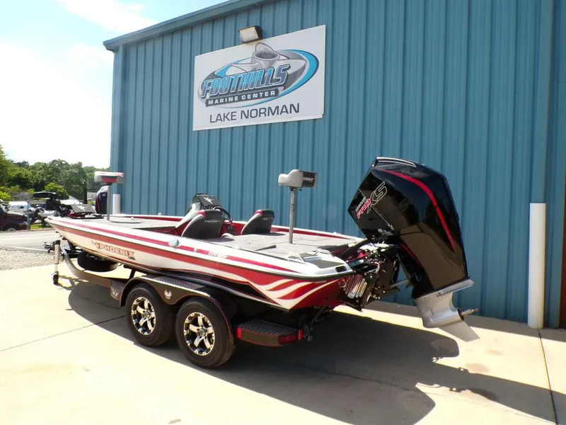 Slide: The Image of Interior of 2025 Phoenix 920 Elite with cup holders and storage compartment. - 19