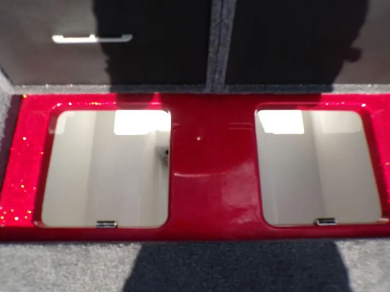 Slide: The Image of Interior of 2025 Phoenix 920 Elite boat with cup holders and warning label. - 23