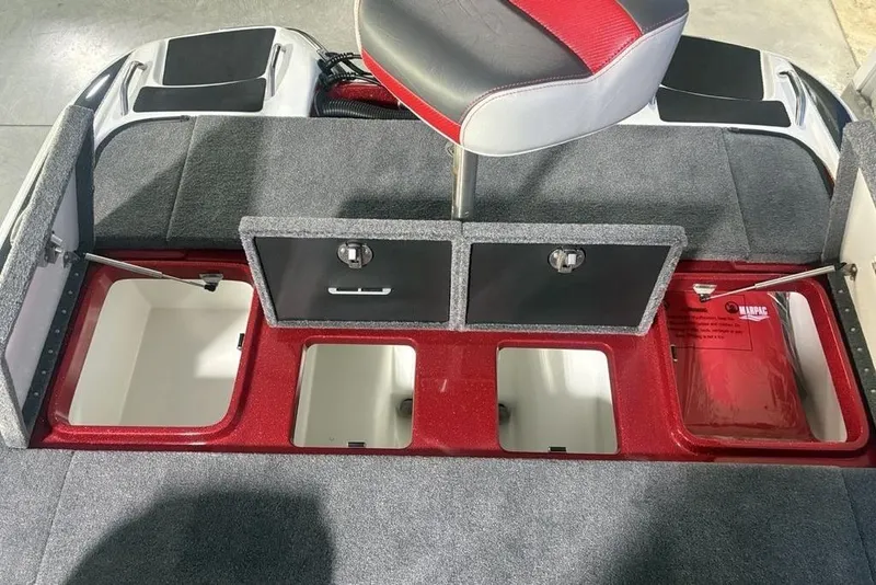 Slide: The Image of 2025 Phoenix 920 Elite boat storage compartments with red and gray interior design. - 27