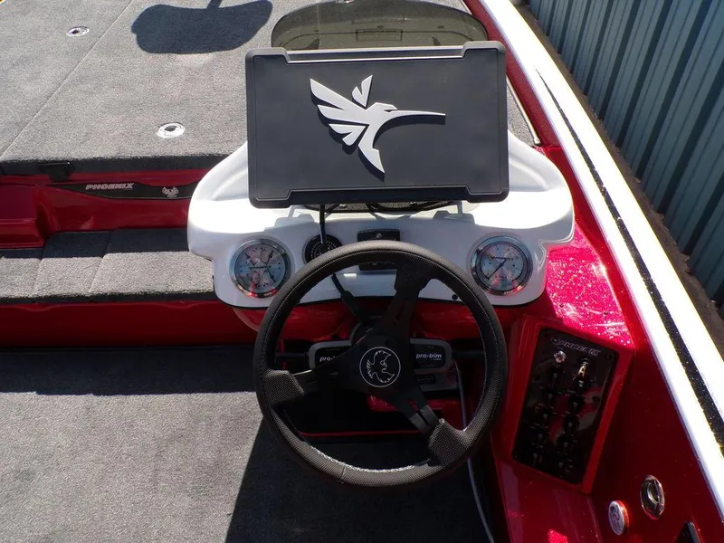 Slide: The Image of 2025 Phoenix 920 Elite boat dashboard with advanced navigation system and controls. - 4