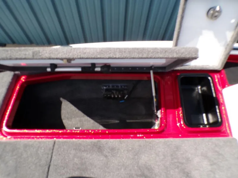 Slide: The Image of 2025 Phoenix 920 Elite boat deck with gray carpet and storage compartments. - 6