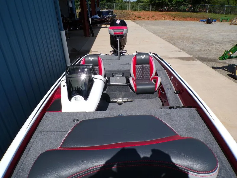 Slide: The Image of Open storage compartment in a 2025 Phoenix 920 Elite boat, featuring organized interior space. - 7