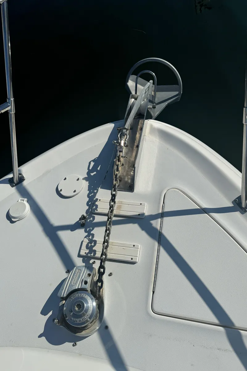 Slide: The Image of Bow of 1998 Sea Ray 400 Express Cruiser with anchor chain and windlass. - 11
