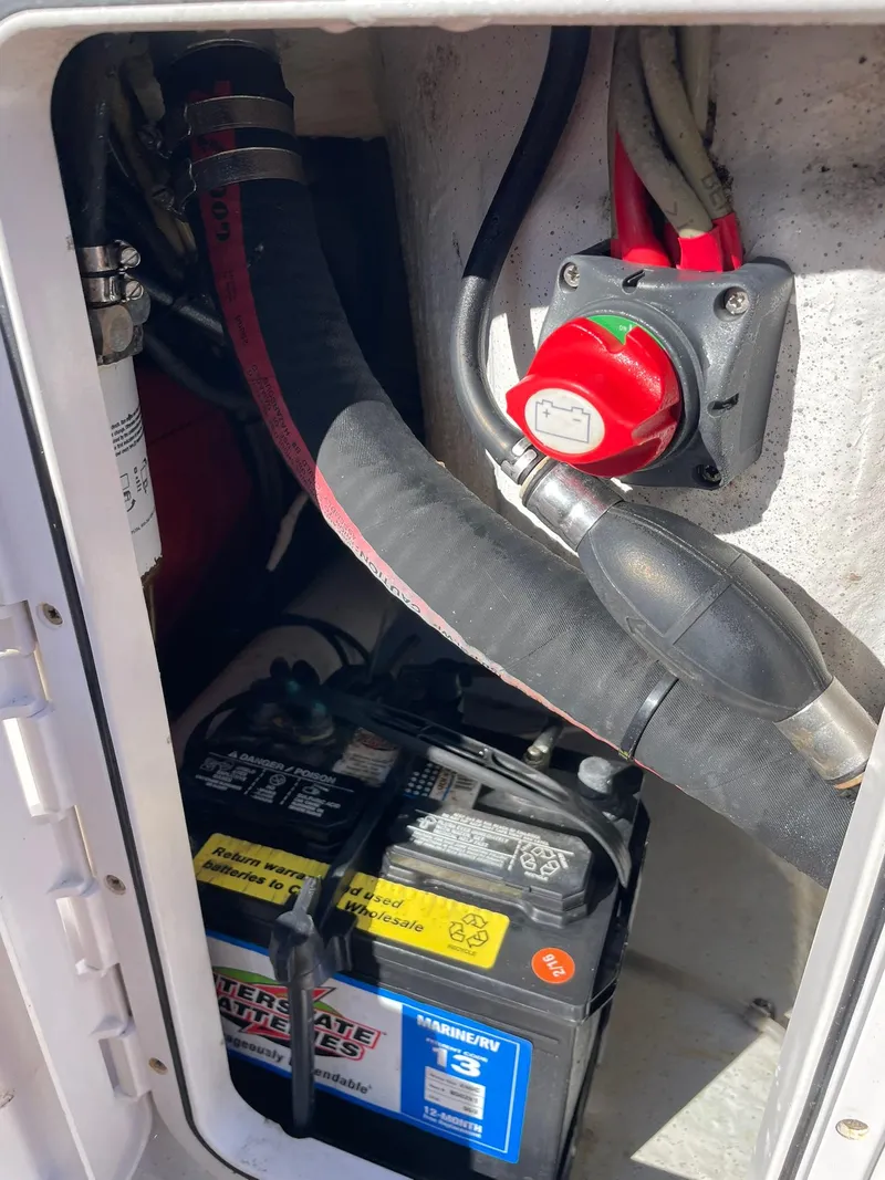 Slide: The Image of Battery compartment of a 2001 Protector Targa 28 boat with wiring and switch. - 23