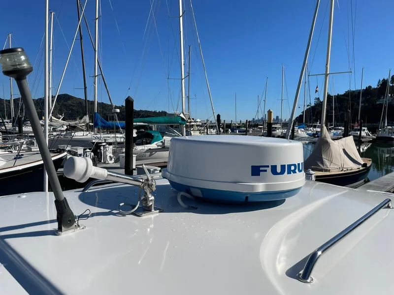 Slide: The Image of 2001 Protector Targa 28 boat with Furuno radar in a marina setting. - 31