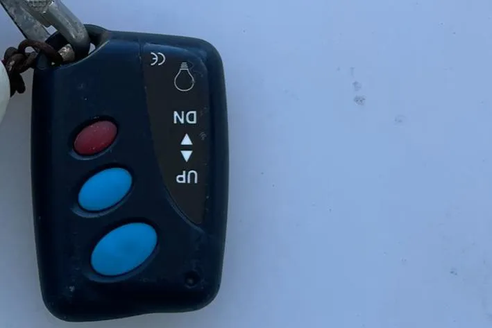 Slide: The Image of Remote control with three buttons for a 2001 Protector Targa 28 boat. - 34