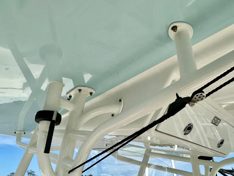 Slide: The Image of 2014 Regulator 28FS boat structure with white framework and rigging details. - 22