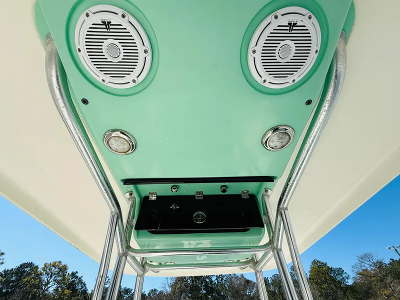 Slide: The Image of 2011 ShearWater 2200 boat T-top with speakers and lights, viewed from below. - 8