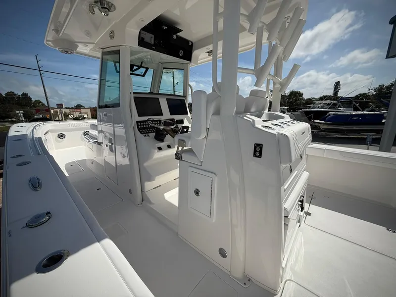 Slide: The Image of 2025 Caymas 34 CT boat interior with modern helm and seating. - 10