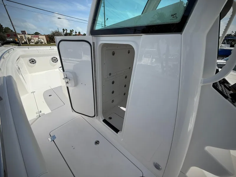 Slide: The Image of 2025 Caymas 34 CT boat interior with open storage compartment. - 18